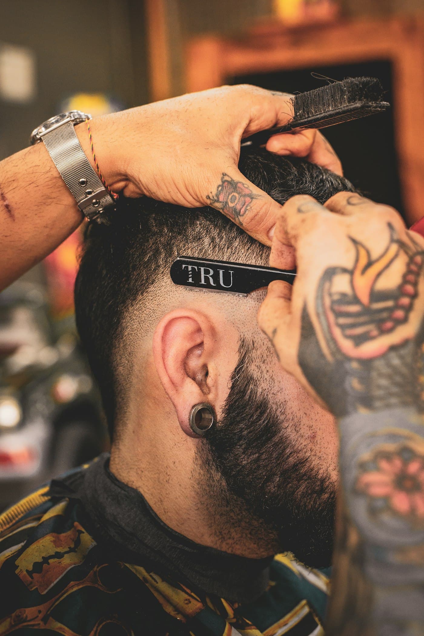 A close view of a clean skin fade on the side of the head