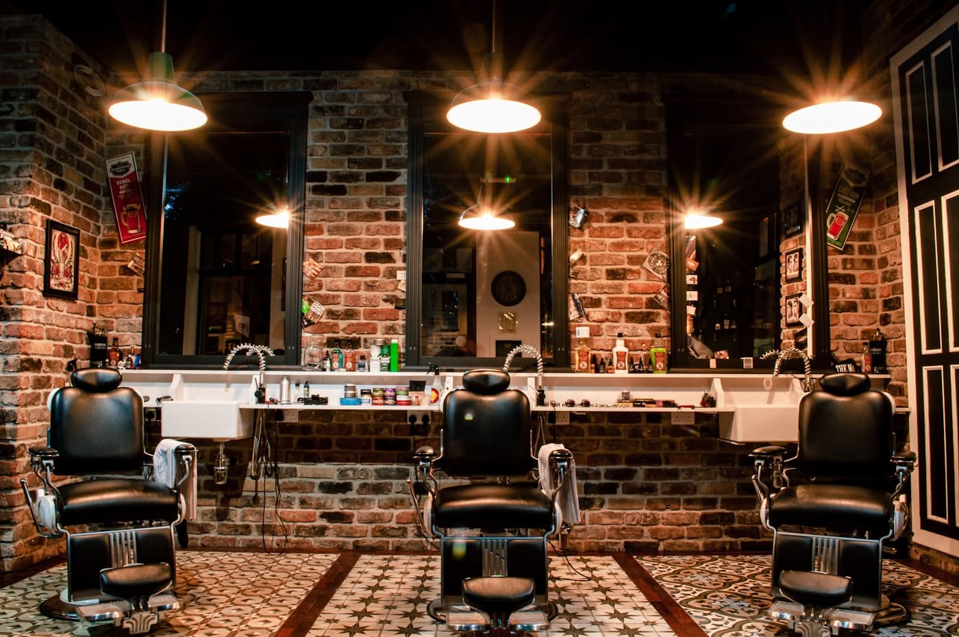 The interior of a calm barber atelier with vintage chairs and warm light